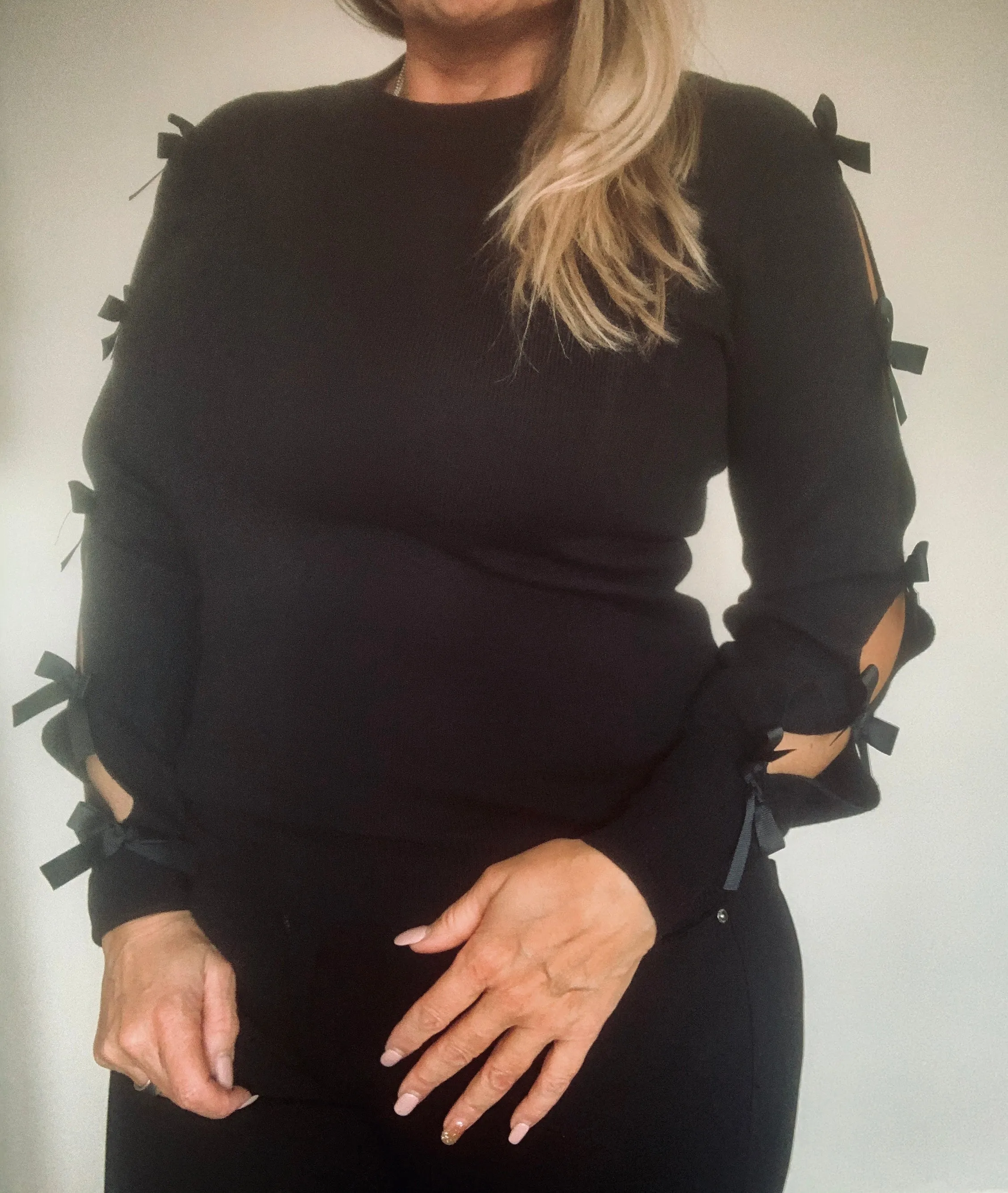 Bow Slit Peep Arm Jumper in Black
