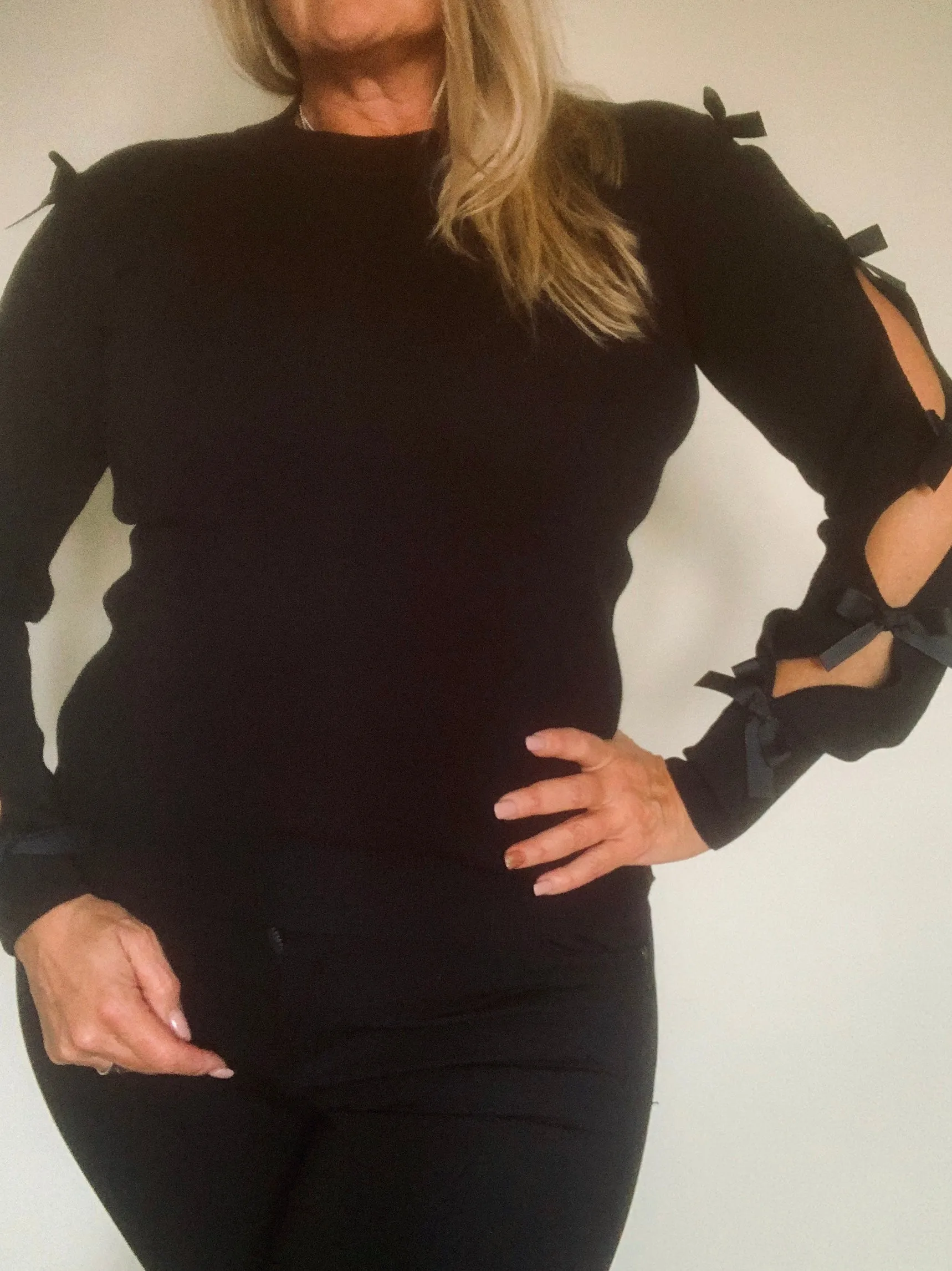 Bow Slit Peep Arm Jumper in Black